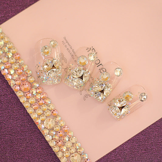 Crystal-embellished jewelry set on a pink and purple background