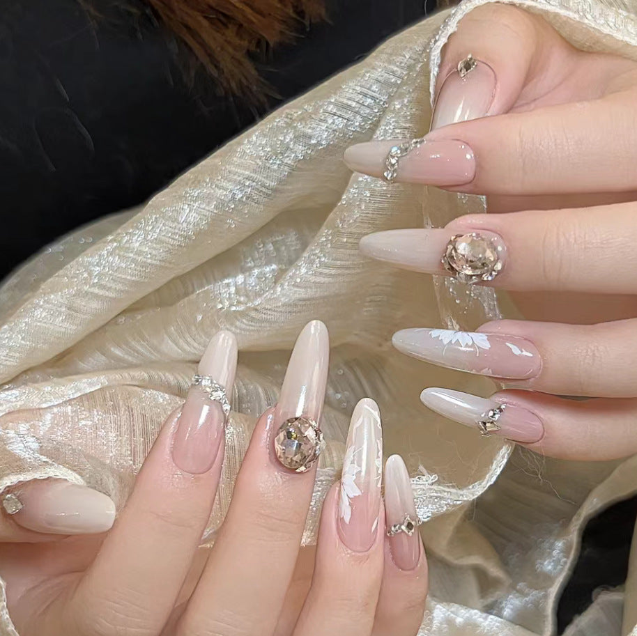 Elegant Crystal Garden Long Almond Beige Ombre Nails with Stunning Gemstones