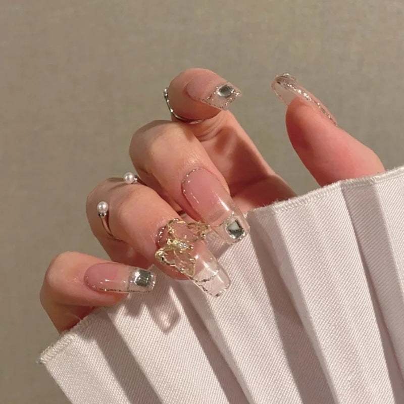 Enchanted Elegance Long Oval Clear Press On Nail Set with Embedded Gold Flakes and Rhinestone Accents