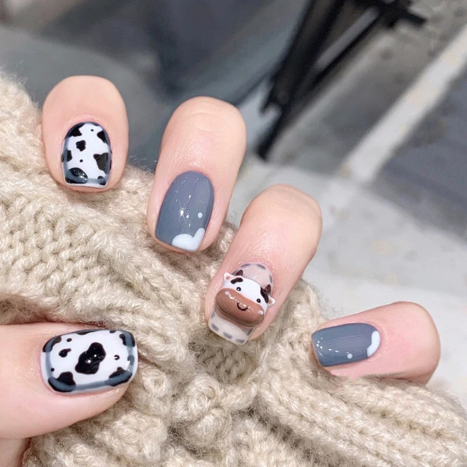 Enchanted Cow Print Short Round Shaped Press-On Nail Set in Grey and White Tones with Delightful Milkshake Accent Design