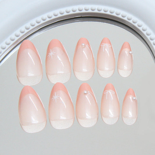 Whimsical Elegance Short Almond Soft Pink Press On Nail Set with Delicate Pearl and Bow Accents