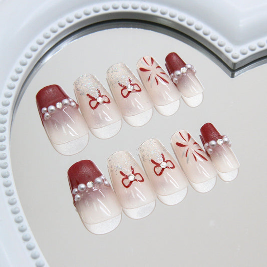 Charming Winter Wonderland Medium Coffin Red and White Gradient Press-On Nail Set with Elegant Pearl Accents