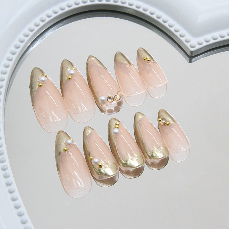 Glamorous Chic Medium Almond Shaped Transparent Pink Press On Nail Set with Gold Accents and Decorative Pearls
