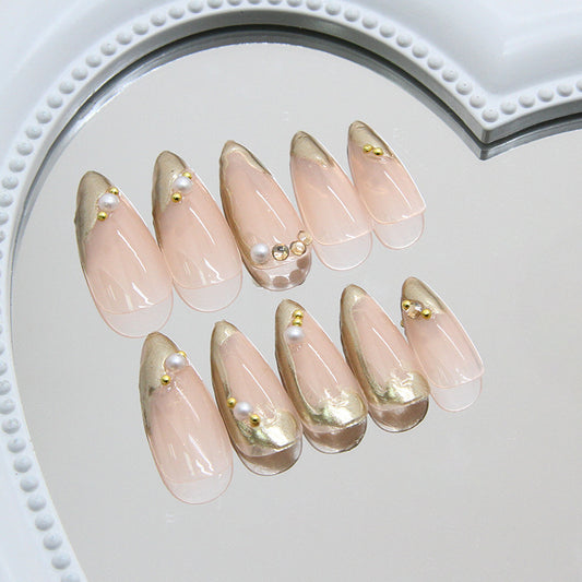 Glamorous Chic Medium Almond Shaped Transparent Pink Press On Nail Set with Gold Accents and Decorative Pearls