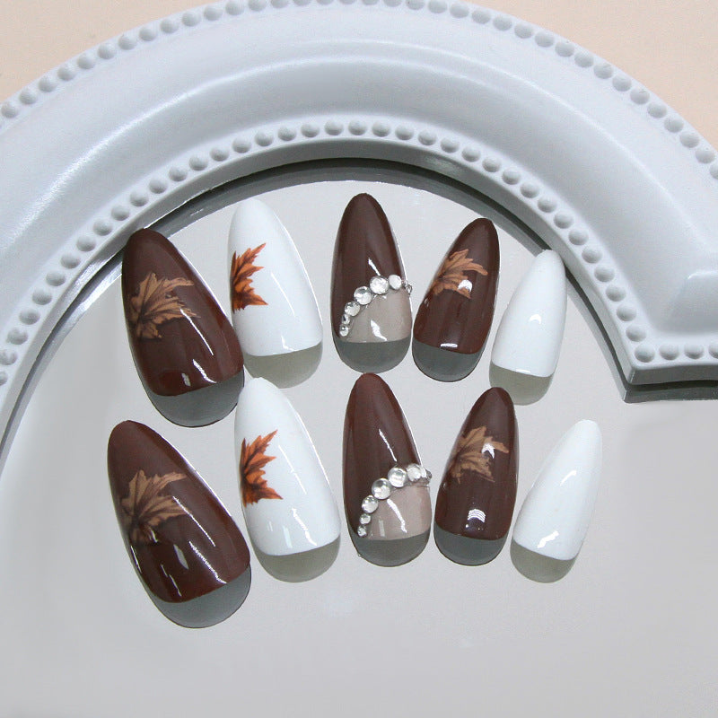 Autumn Elegance Bold Medium Almond Brown and White Press on Nail Set with Unique Leaf Artwork and Dazzling Rhinestones