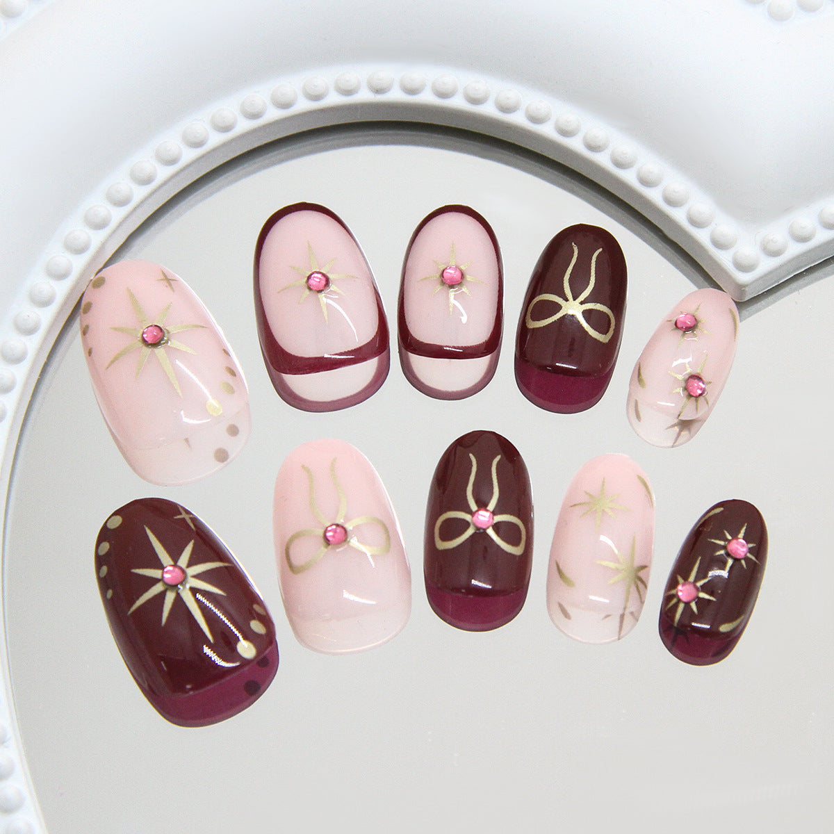 Elegant Gala Short Oval Burgundy and Pink Press On Nail Set with Shimmering Gemstone Accents