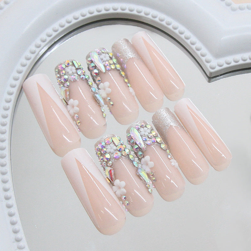 Whimsical Elegance Long Square Pink Nails with Sparkling Rhinestones and Floral Accents