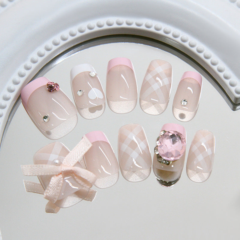 Charming Pastel Elegance Short Square Pink and Clear Nails with Decorative Gems and Ribbons