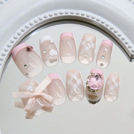 Charming Pastel Elegance Short Square Pink and Clear Nails with Decorative Gems and Ribbons