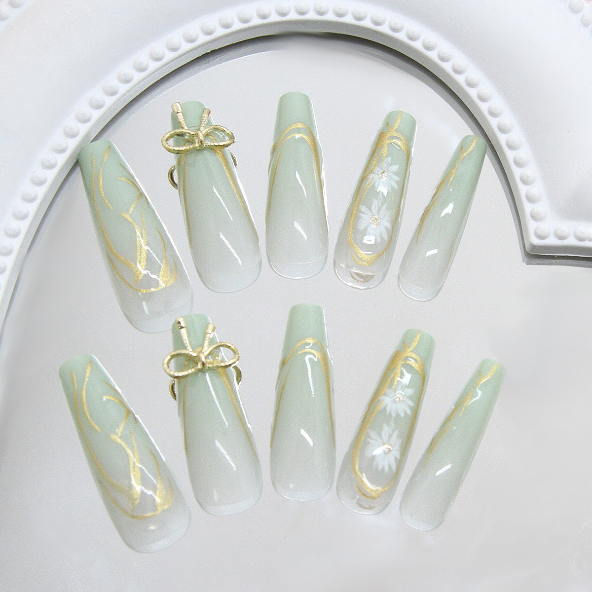 Whimsical Elegance Long Coffin Mint Green Press On Nail Set with Delicate Gold Accents and Floral Designs