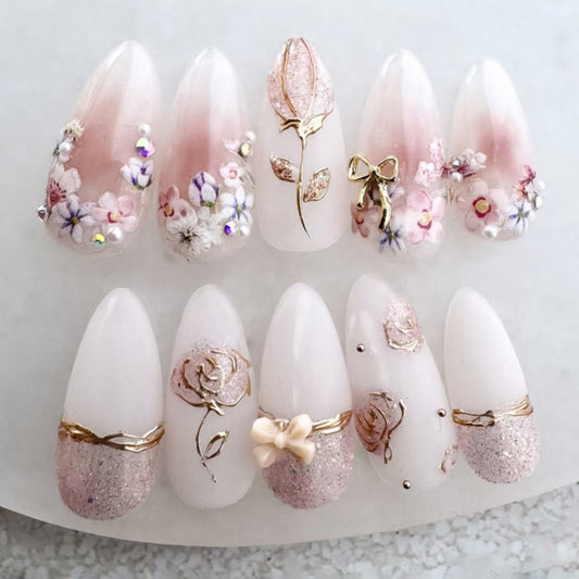 Whimsical Garden Dream Press-On Nail Set in Medium Almond Shape Soft Pink Color with Floral and Glitter Accents
