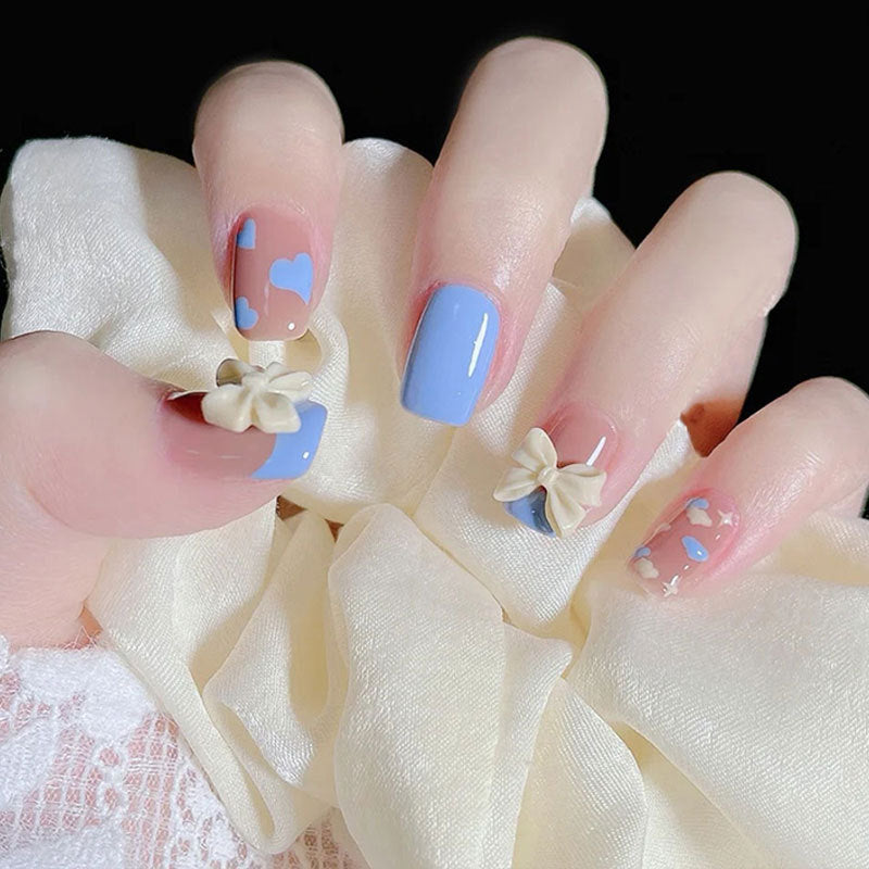 Enchanted Elegance Short Round Pastel Blue and Pink Press On Nails with Bow Accents and Heart Design