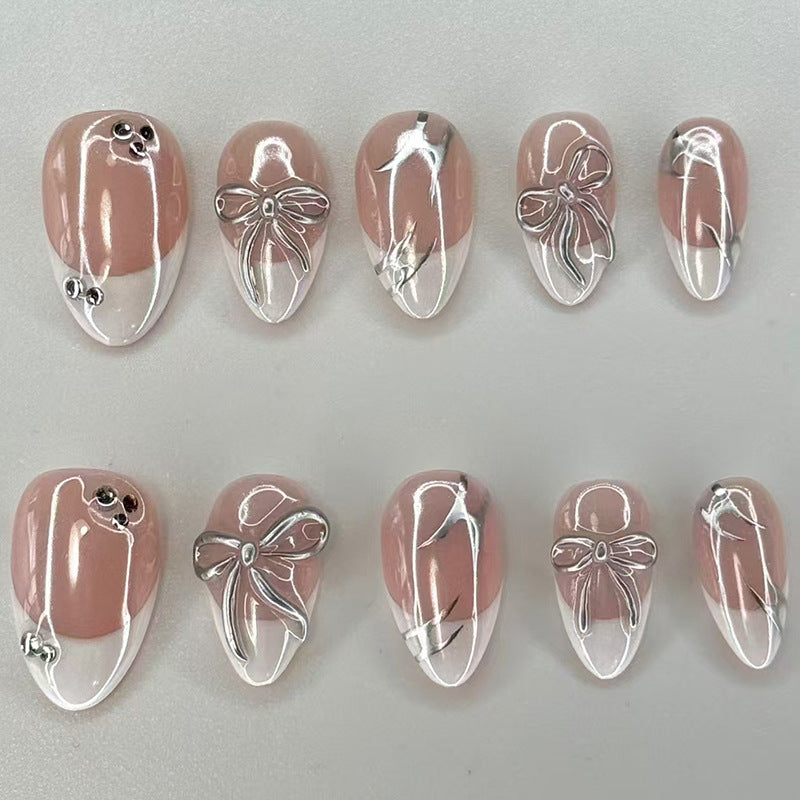 Elegant Blossom Inspired Press On Nail Set in Short Almond Shape Soft Pink with Iridescent Bow Design