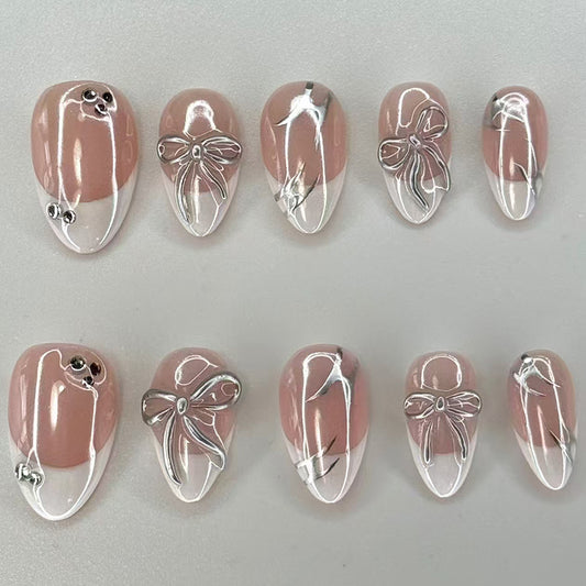 Elegant Blossom Inspired Press On Nail Set in Short Almond Shape Soft Pink with Iridescent Bow Design
