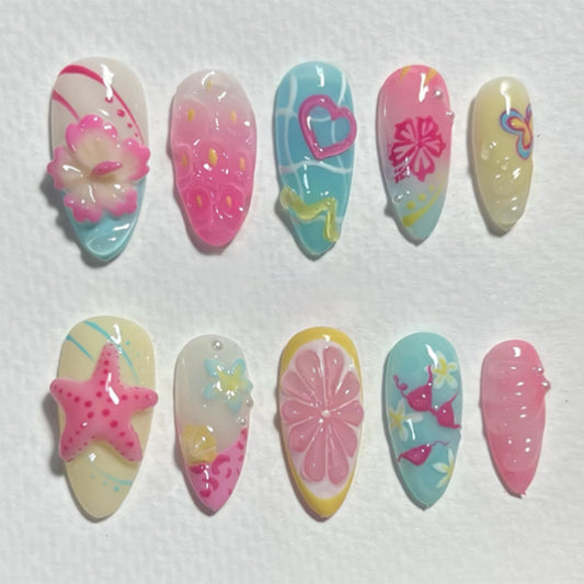Tropical Paradise Press On Nail Set Medium Almond Shape Vibrant Pink and Blue with Playful Sea Themes