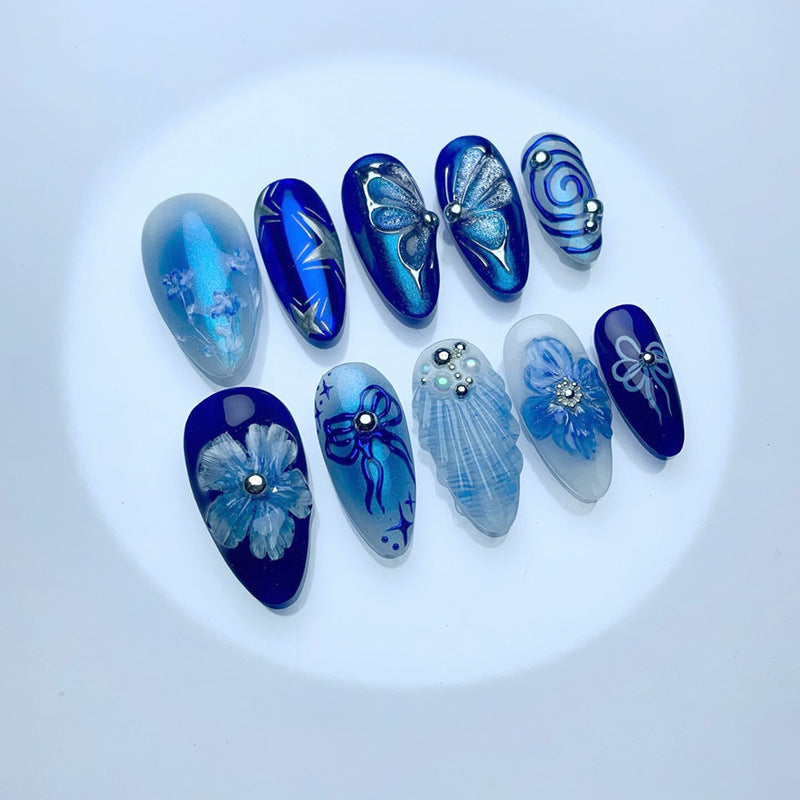 Ocean Elegance Medium Almond Blue Press On Nail Set Featuring Stunning Floral and Butterfly Designs