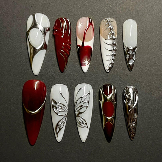 Gothic Elegance Long Stiletto Red and White Press On Nail Set with Intricate Metallic Design and Butterfly Accents