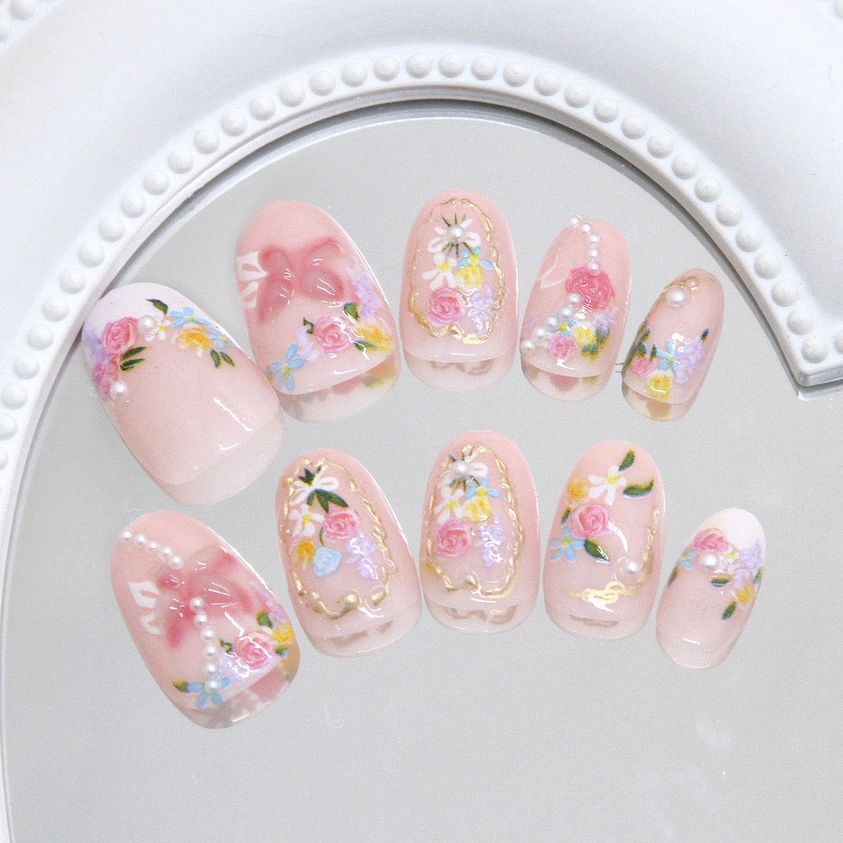 Whimsical Floral Fantasy Short Oval Pink Press-On Nail Set with Charming Decals and Elegant Pearls