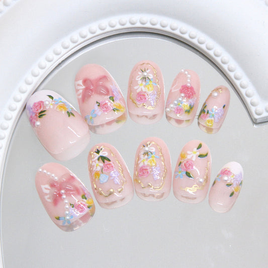 Whimsical Floral Fantasy Short Oval Pink Press-On Nail Set with Charming Decals and Elegant Pearls