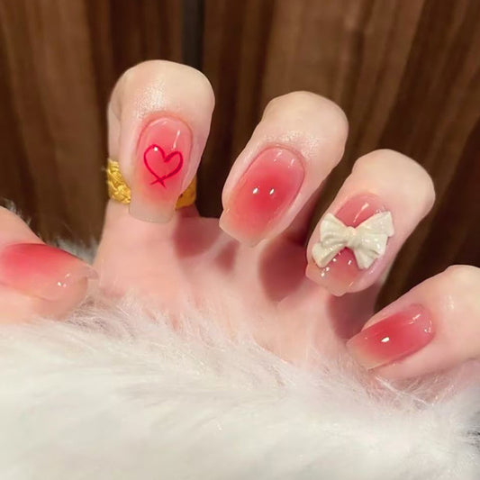 Romantic Delight Medium Square Gradient Pink Nails with Heart and Bow Accents