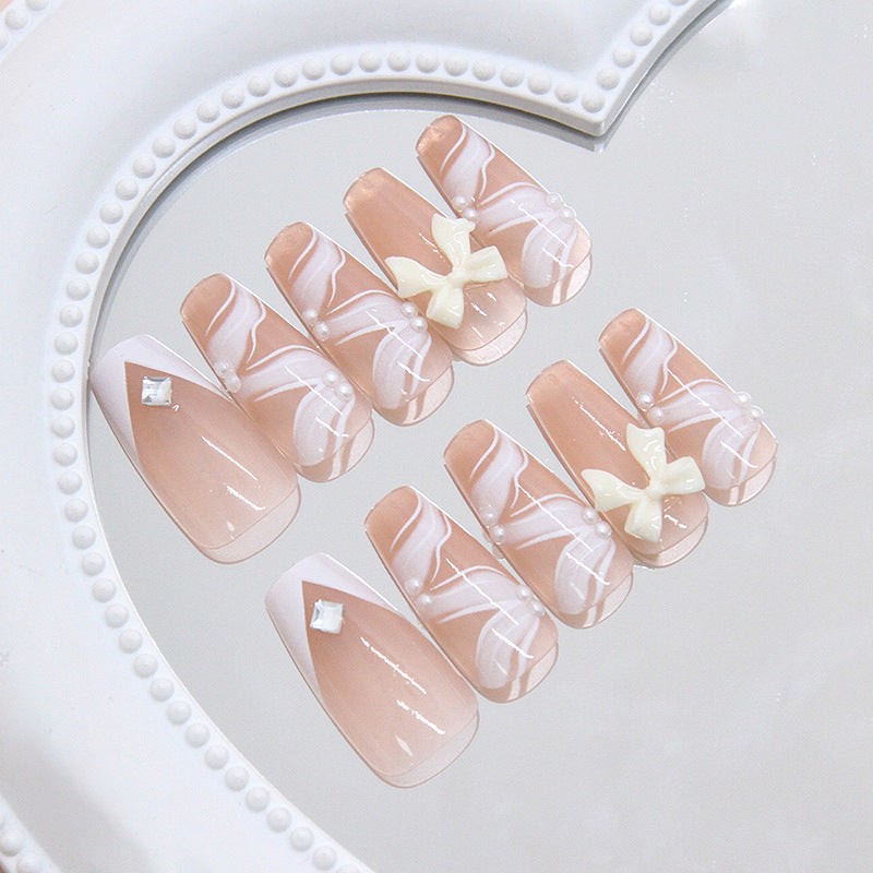 Whimsical Romance Long Coffin Soft Pink with Elegant White Swirls and Charming Bow Accents Press On Nail Set