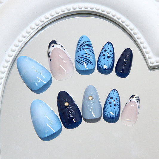 Ocean Breeze Medium Almond Shaped Blue Ombre Nail Set with Floral Accents and Pearl Detail