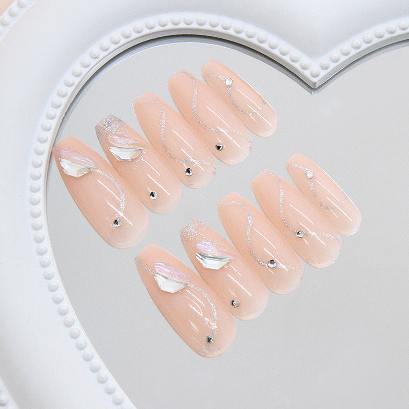 Dreamy Elegance Long Coffin Blush Pink Nails with Dazzling Gem Accents and Shimmering Waves