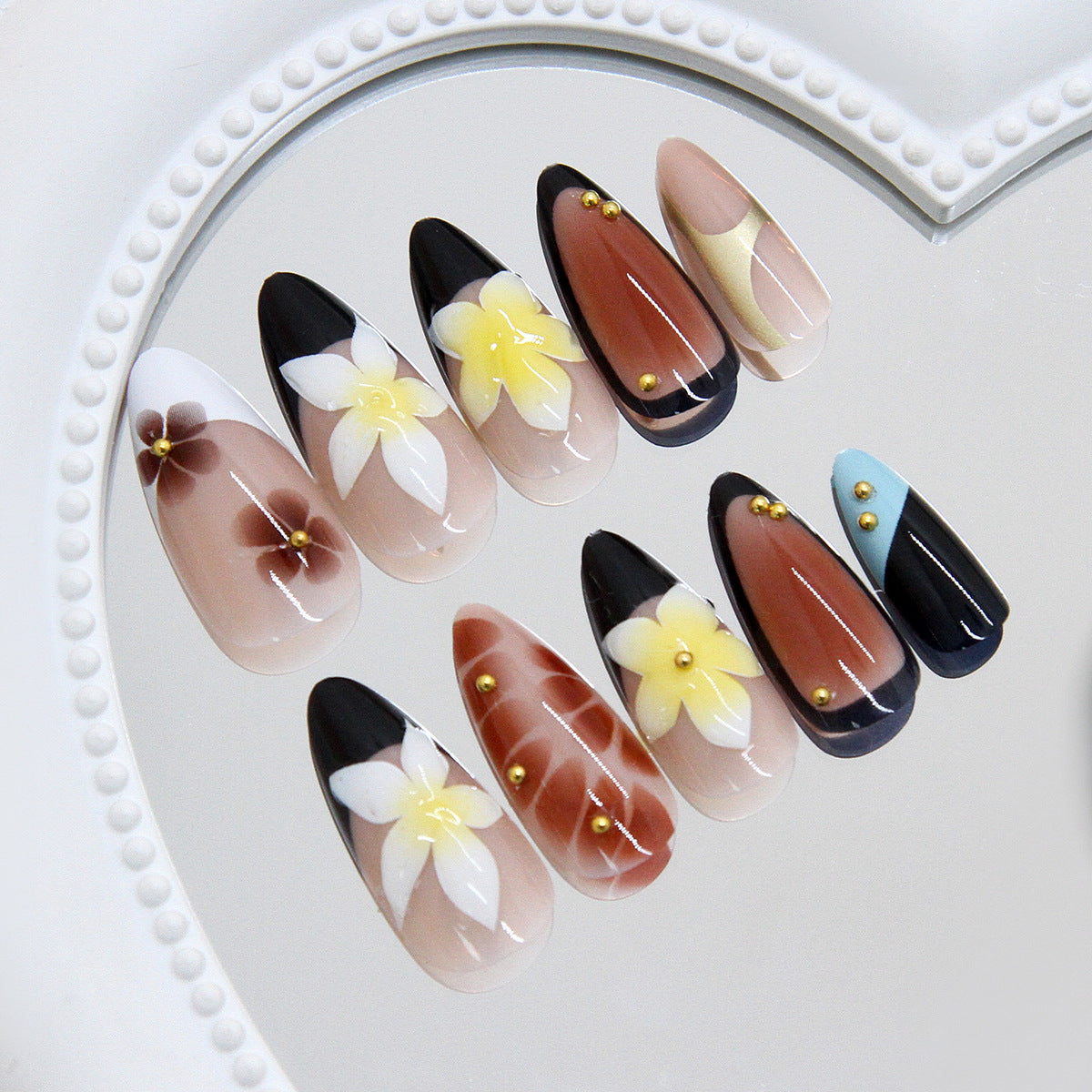 Botanical Bliss Artistic Almond Shaped Long Press-On Nail Set in Black Brown and White with Floral Accents and Gold Studs