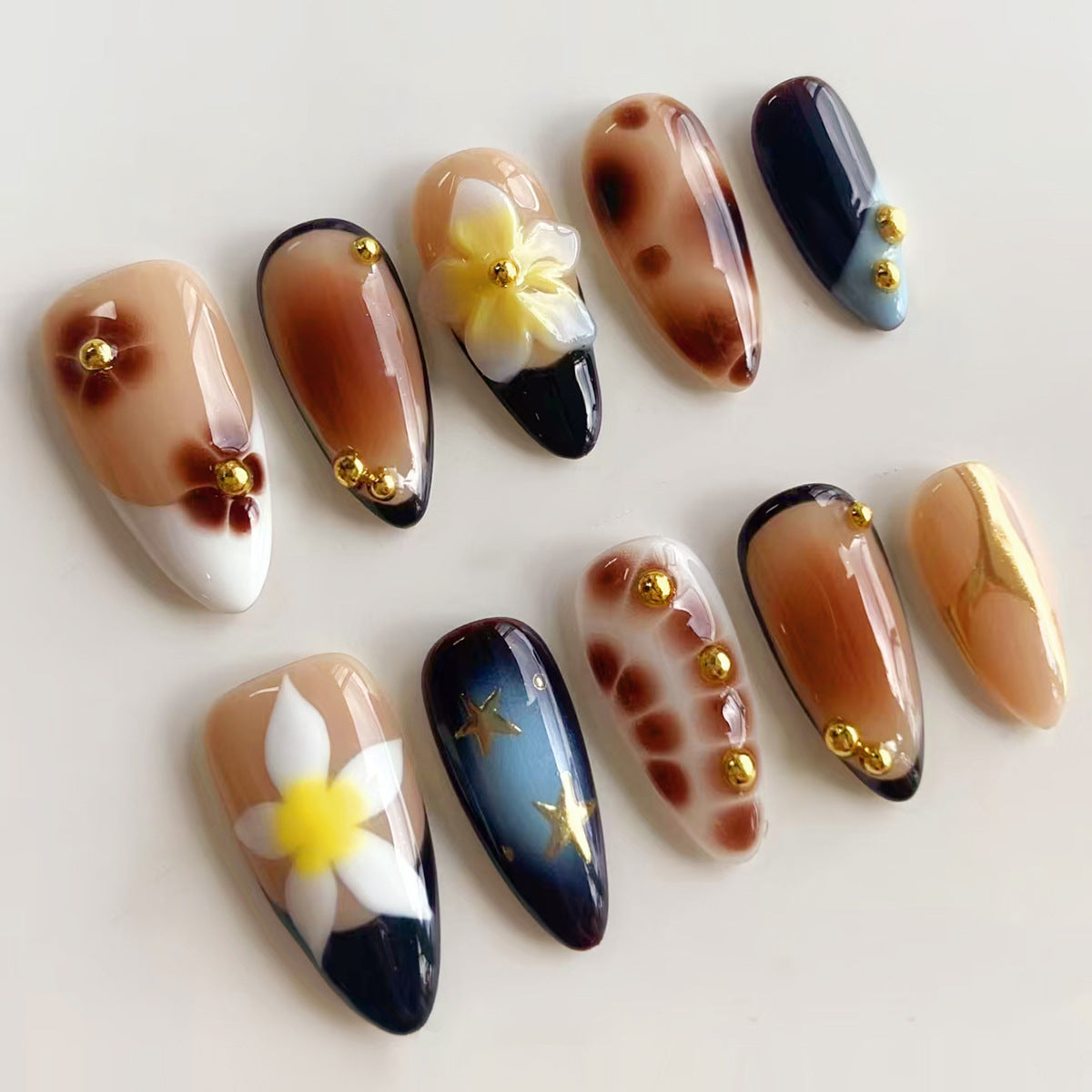Elegant Fusion Long Almond Shaped Beige and Navy Press On Nail Set with Floral and Gold Accent Features