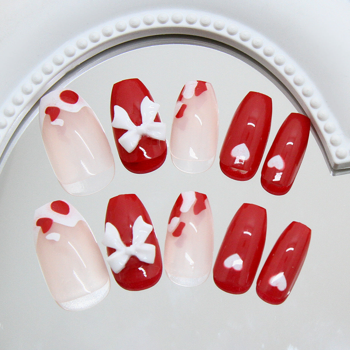 Romantic Glamour Medium Coffin Red and Clear Press on Nail Set with Whimsical Bow and Heart Accents