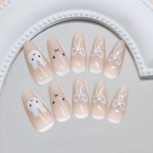 Whimsical Wonderland Long Almond Beige with Playful Bunny Designs and Elegant Bow Accents Press On Nail Set
