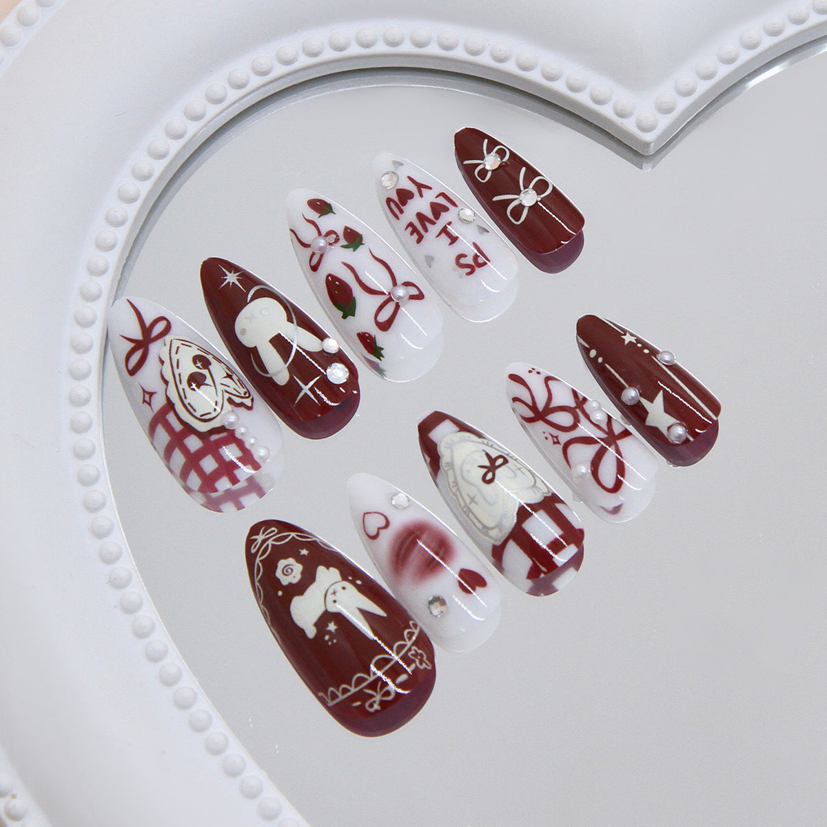 Enchanting Holiday Charm Elegant Medium Almond Burgundy and White Press-on Nail Set with Festive Designs and Adornments