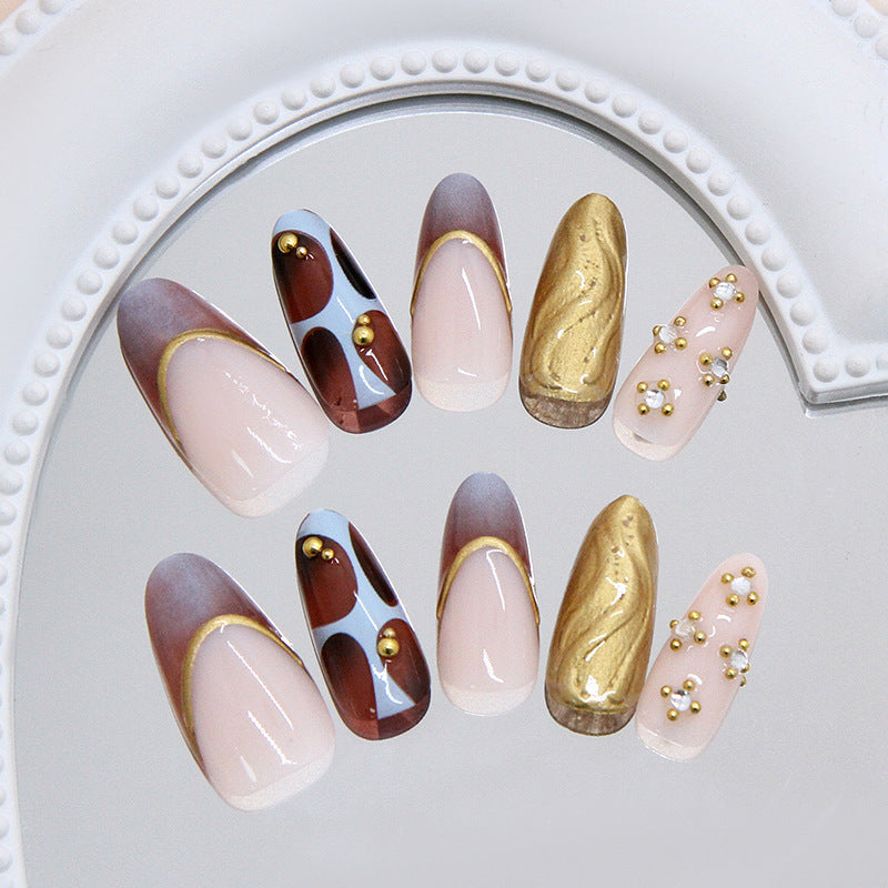 Glamorous Elegance Long Almond Brown and Gold Swirl Press On Nail Set with Decorative Baubles