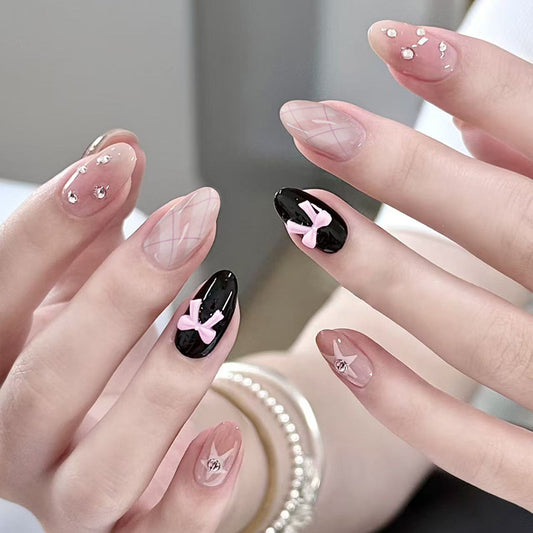 Chic Elegance Stylish Long Almond and Coffin Press On Nail Set in Soft Pink and Black with Charming Bow Accents and Sparkling Embellishments