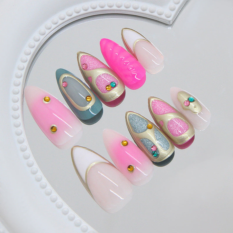 Whimsical Elegance Long Almond Shaped Pink and Grey Gradient Nails with Gold Accent Gems