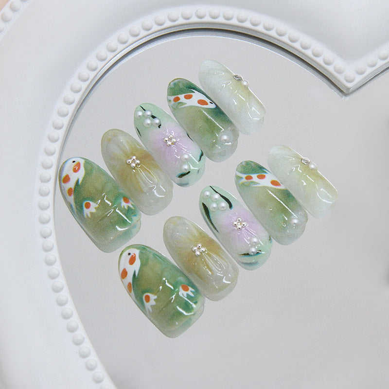 Whimsical Garden Inspired Long Oval Shape Translucent Green With Floral Designs and Pearl Accents Press On Nail Set