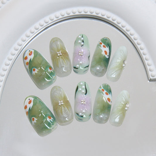 Serene Nature Inspired Long Oval Shaped Green with Floral Accents and Pearl Embellishments Press On Nail Set