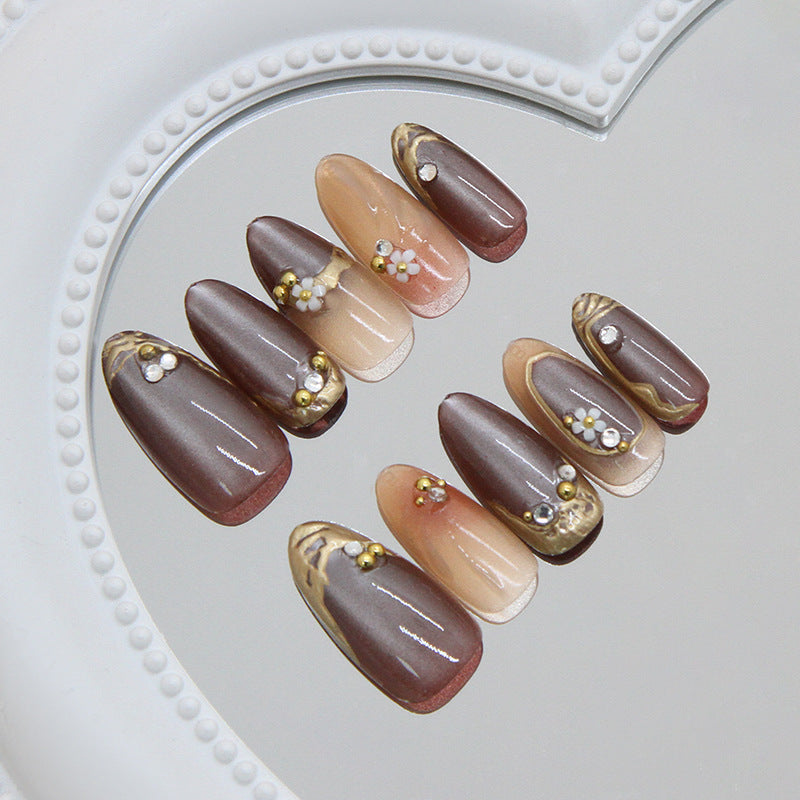 Elegant Serenity Press On Nail Set Long Almond Brown with Golden Accents and Floral Embellishments