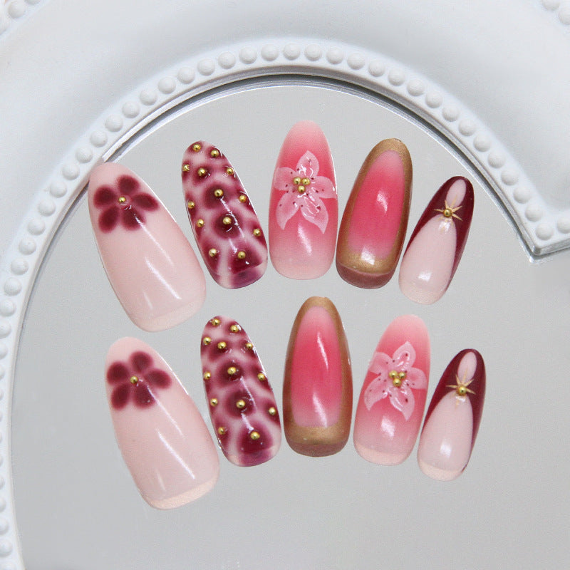 Blooming Elegance Long Almond Gradients in Soft Pink and Rich Burgundy with Floral Accents and Gold Studs