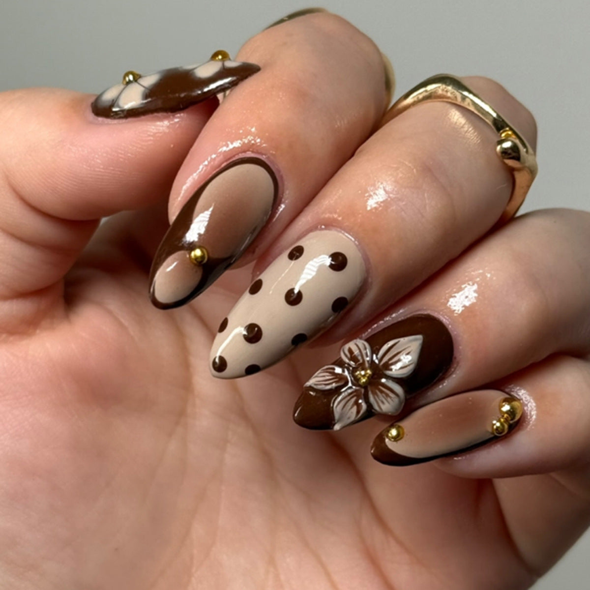 Chocolate Dream Long Almond Shaped Brown and Beige Press on Nail Set with Floral Accents and Gold Studs