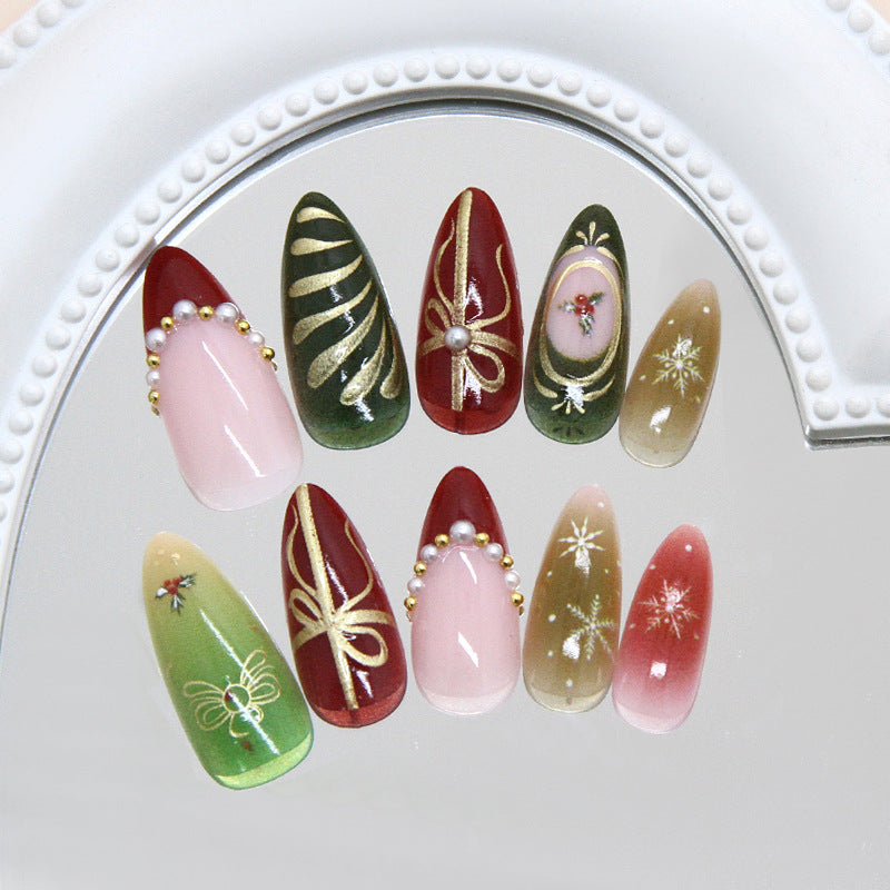 Festive Elegance Long Almond Red and Green Nail Set with Glittering Decorations and Artistic Designs