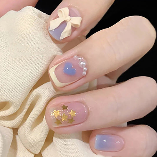 Elegant Touch Fantasy Short Round Pastel Pink and Lavender Press On Nails with Rhinestone Accents and Gold Glitter Stars
