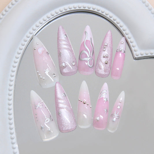 Whimsical Pink Elegance Long Stiletto Shaped Glossy Pink Press On Nail Set with Glittering Accents and Intricate Designs