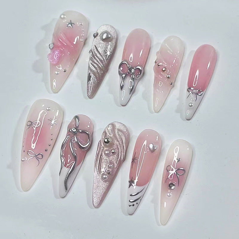 Whimsical Dream Press On Nail Set in Long Stiletto Shape with Soft Pink Color and Stunning Bow and Gem Accents
