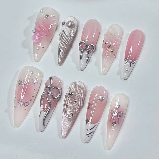 Whimsical Dream Press On Nail Set in Long Stiletto Shape with Soft Pink Color and Stunning Bow and Gem Accents