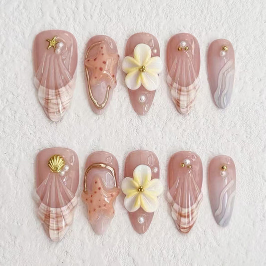 Coastal Dream Elegant Long Almond Shaped Blush Pink Nail Set with Floral and Shell Accents