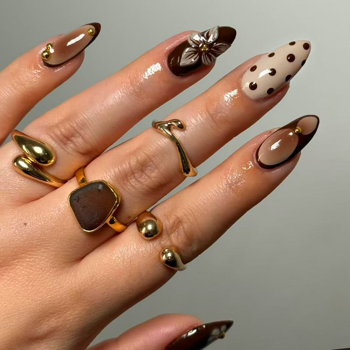 Elegant Luxe Long Almond Brown Ombre Nails with Floral Accent and Dots