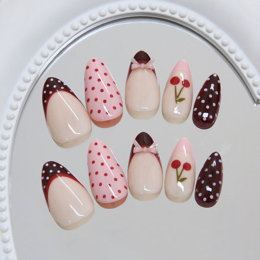 Delightful Dessert Inspired Press On Nail Set in Long Almond Shape Blush Pink with Chocolate Accents and Charming Bow Detail