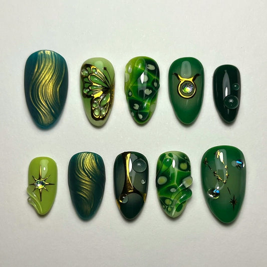 Enchanted Forest Long Almond Green Nail Set with Shimmering Gold Accents and Unique Butterfly Design