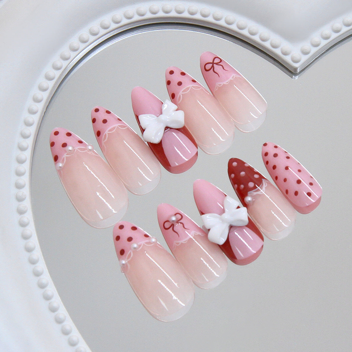 Chic Whimsical Stiletto Press On Nail Set Long Almond Pink with Bow Decoration and Polka Dots